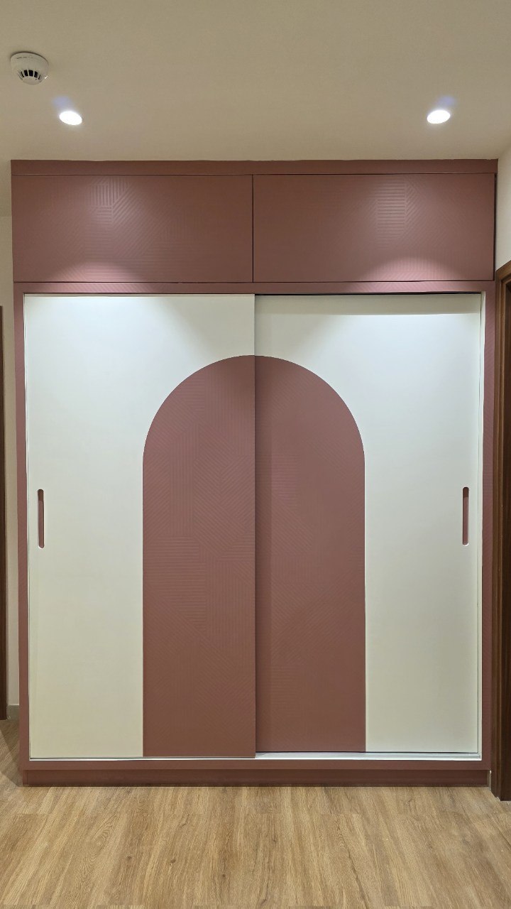 Terracotta and cream wardrobe with arched sliding shutters
